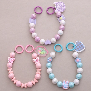 Colorful handmade beaded bag charms with bowknot, stars, and cartoon rabbit pendants