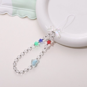 Macro shot of handmade beaded phone strap with iridescent bow and colorful star beads