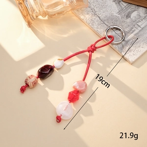 Handmade woven PU leather cord pendant with red acrylic beads and metal spring clip
