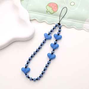 Detailed view of handmade beaded phone strap with blue hearts and striped round beads