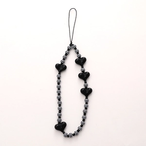Minimalist black and white striped beaded phone strap with glossy heart charms