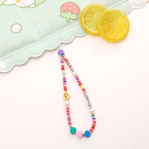 Close-up of colorful handmade beaded phone strap with smiley face and LOVE charms