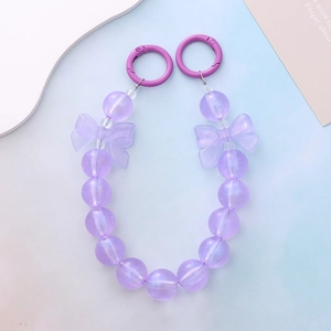 Dreamy purple beaded phone charm with glowing bows and mermaid gradient glitter beads