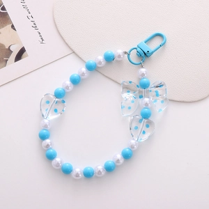 Blue and white beaded floral keychain with polka dot heart and bow charms for phone cases