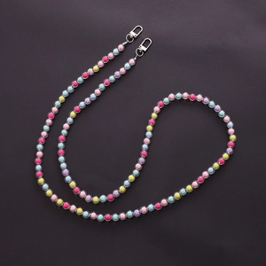 Detail of colorful candy-colored acrylic beads with lobster clasps for mobile phone straps