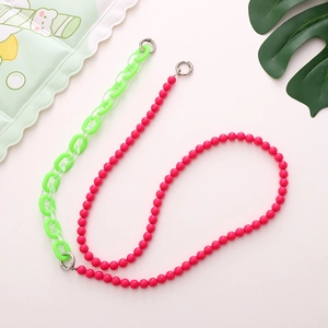 Detailed view of candy-colored acrylic link chain and pink beads with metal spring buckles