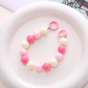 Detail of 16mm pink and cream acrylic beads phone strap with spring ring clasps