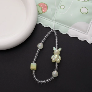 Close-up of beaded phone charm with iridescent rabbit pendant and colorful resin beads