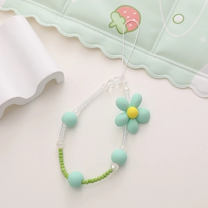 Close-up of mint green rabbit theme beaded phone lanyard with floral charms