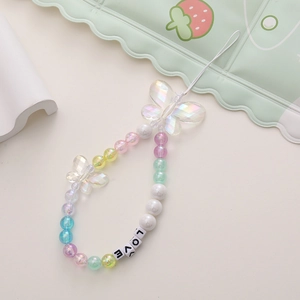 Detailed view of handmade beaded phone strap with LOVE cube beads and clear butterflies