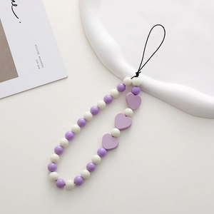 Beaded cell phone charm with purple and white beads and wooden heart pendants