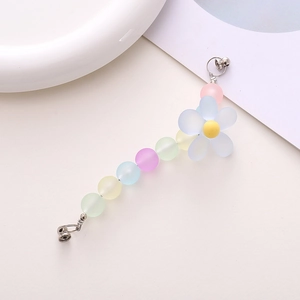 Detail of matte pastel beads and blue flower charm on this beaded phone strap