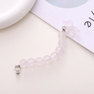 Detail of pink frosted beads and bear pendant for DIY phone chain and accessories
