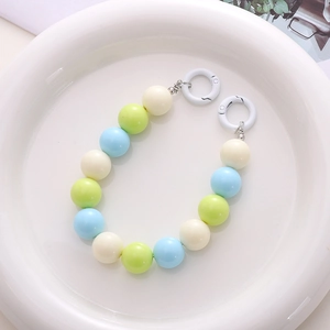 Detail of 16mm macaron acrylic beads phone strap with white round spring clasps