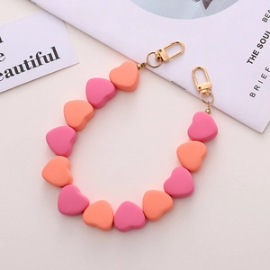 Catenella di perle a cuore in acrilico con chiusura a moschettone per cellulari e borse