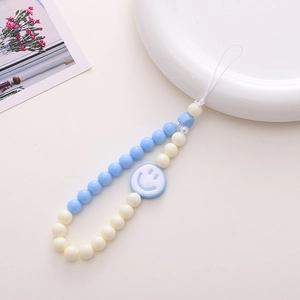Detailed view of handmade sky blue acrylic beaded phone strap with a smiley face charm