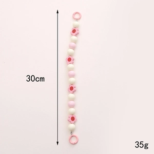 Handmade pink wooden flower phone charm strap with beaded design and clip for accessories
