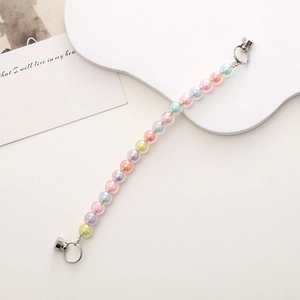 Detail of macaron colored beads with silver magnetic clasps for phone case chain