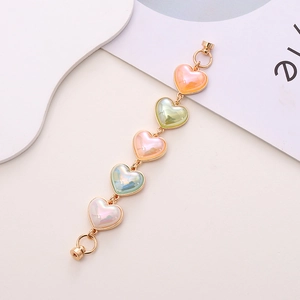 Colorful acrylic heart phone strap with iridescent charms and golden magnetic clasp