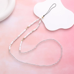 Detailed macro view of beaded phone strap with LOVE letter charms and crystal beads