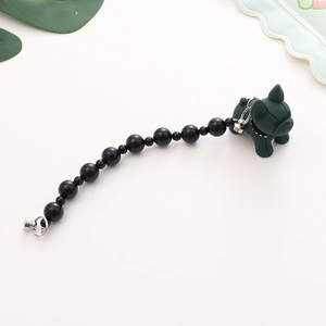 Detail of beaded resin French Bulldog keychain charm with silver metal screw clasps