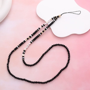 Fashionable crystal beaded phone strap with LOVE letter charms on a pink background