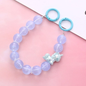 Pastel lavender beaded phone strap with a dreamy blue unicorn pendant and blue hooks