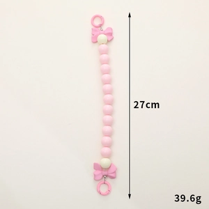 Pink acrylic beaded phone strap with bow accents and 27cm hanging chain for bags