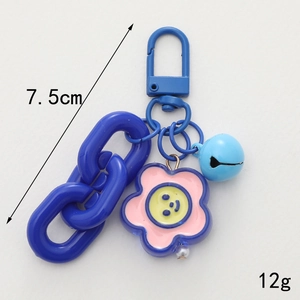 Blue cartoon keychain with spring clip, plastic chain, pink flower and small bell