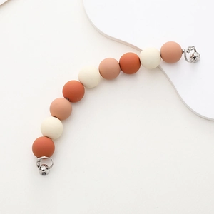 Detail of matte acrylic beads phone chain with frosted texture in Morandi colors
