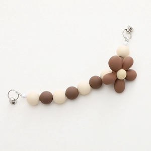 Matte acrylic flower phone strap with brown beads and polished silver hardware
