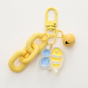 Cute yellow bee keychain with plastic chain, colorful bell, and pearl detail for bags
