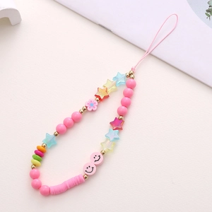 Close-up of colorful handmade phone charm with star, smiley face and flower beads