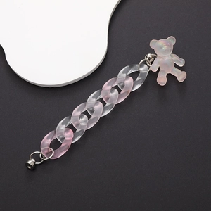 Detail of frosted pink acrylic phone chain with iridescent bear pendant and silver clasp