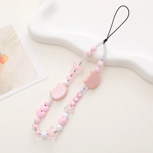 Detail of pink and white beaded phone strap with cute cat charms and heart-shaped beads