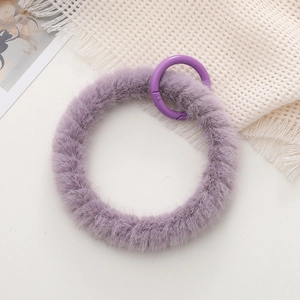 Plush purple O-ring keychain accessory with fuzzy texture and matching metal clip