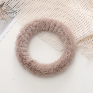 Close-up of a soft plush fuzzy phone wrist strap in lotus pink faux rabbit fur