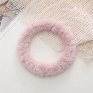 Close-up of soft pink plush phone strap ring with dense faux fur and cozy aesthetic