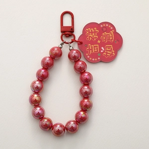 Festive red beaded keychain with Chinese lucky charm and metallic iridescent beads