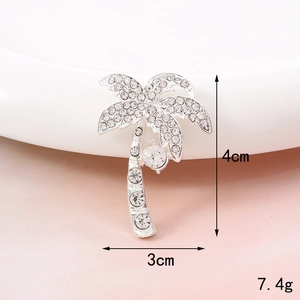Macro detail of coconut tree brooch with sparkling rhinestones and size dimensions
