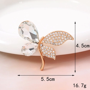 Detail view of butterfly charm with rose gold frame and dimensions 5.5cm by 4.5cm