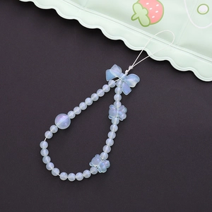 Dragonne de téléphone en perles bleues irisées avec breloque patte et nœud