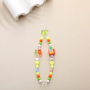 Detailed view of colorful beaded phone charm with honeybee and heart acrylic beads