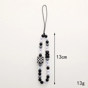 Candy bear phone charm with black and white checkered beads and 13cm wrist strap lanyard
