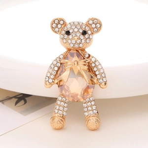 Sparkling crystal teddy bear brooch with amber teardrop gemstone and gold plating