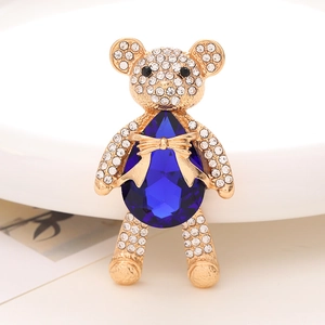 Detail of bear brooch with blue pear-shaped crystal and white zircon pavé setting