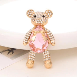 Golden teddy bear pendant with pink teardrop crystal and white rhinestones
