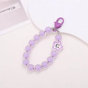 Macro view of purple beaded keychain with heart clasp and smiley star charm detail