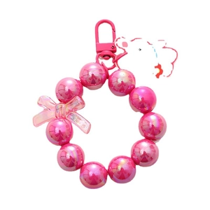 Pink iridescent beaded bear keychain with bow charm and metallic carabiner clip