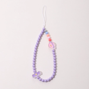 Beaded handmade phone lanyard with purple beads, planet charm and candy pendant on white